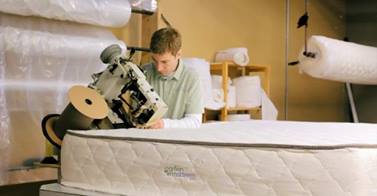 This is Tim, owner of My Green Mattress, working on making one of his amazing organic mattresses! 